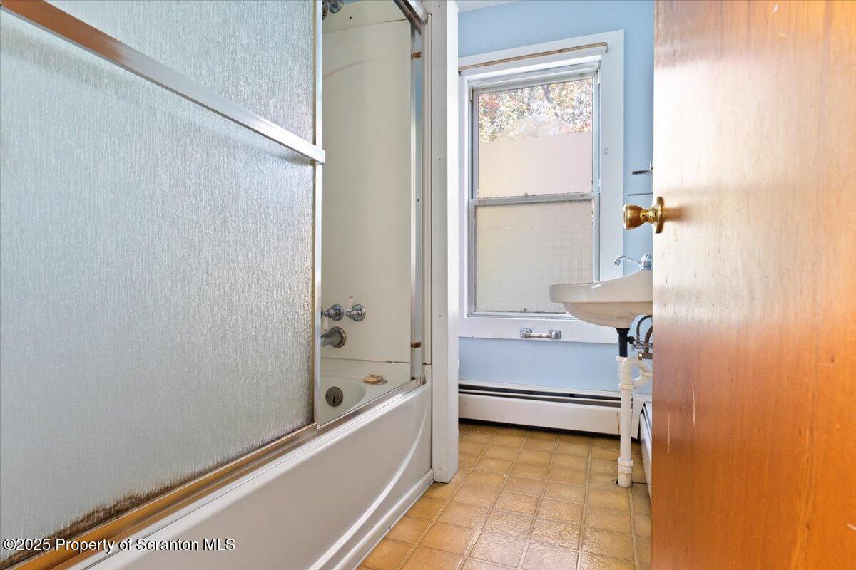 76 Mary Street Ashley, PA 18706 - Photo 26 of 30 a bathroom with a tub and a shower