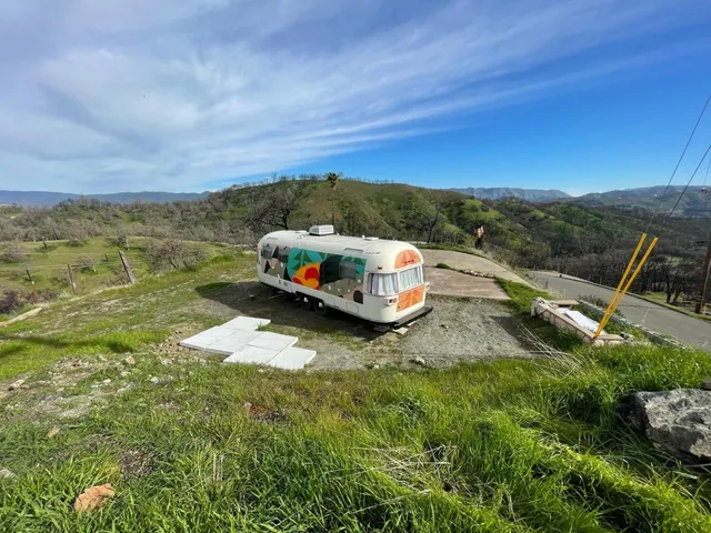 a aerial view of a house with mountain view