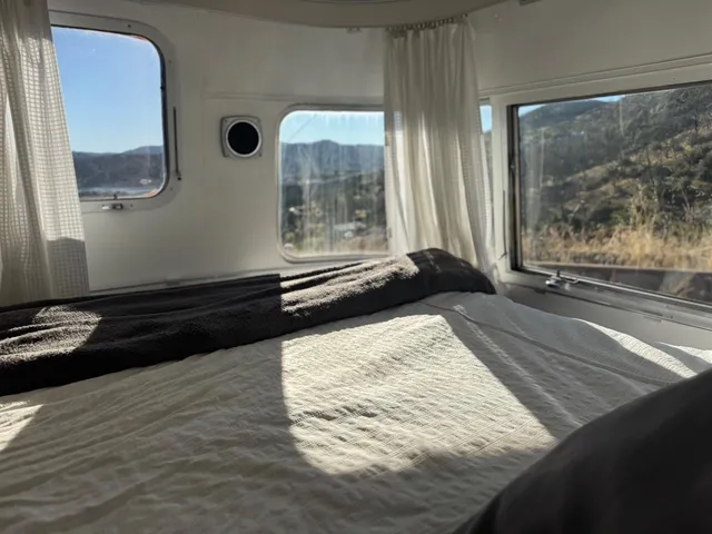 an aerial view of residential house and car parked