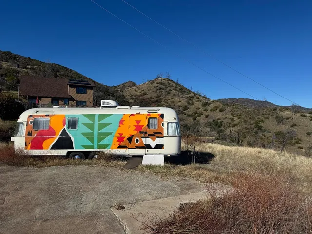 a front view of a couch with wooden floor