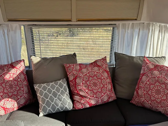 a view of living room with furniture and a window