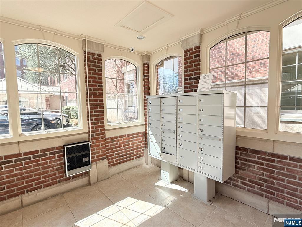 3104 Rio Vista Drive, Unit 3104 Mahwah, NJ 07430 - Photo 27 of 32 a view of front door with furniture and fireplace