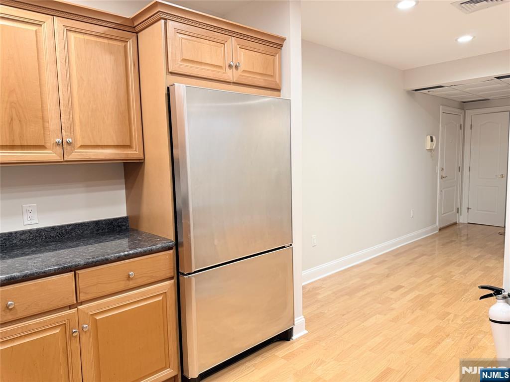 3104 Rio Vista Drive, Unit 3104 Mahwah, NJ 07430 - Photo 7 of 32 a kitchen with a refrigerator and cabinets