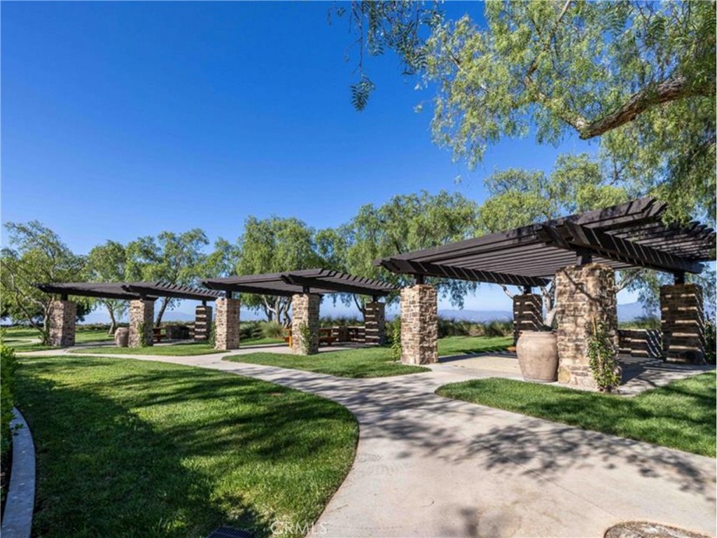 38 Arcade Irvine, CA 92603 - Photo 36 of 40 a front view of a house with a garden