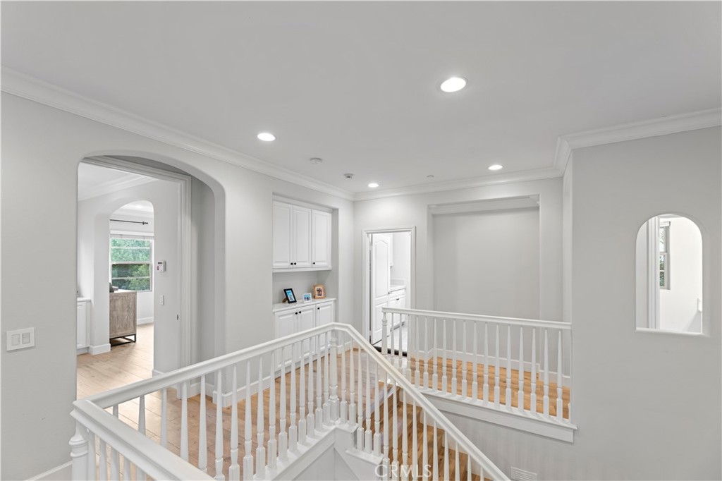 38 Arcade Irvine, CA 92603 - Photo 8 of 40 a view of a hallway with windows