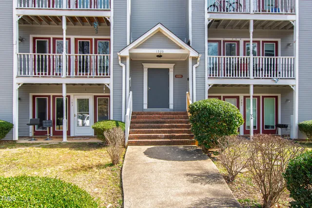 a view of a brick building with large windows
