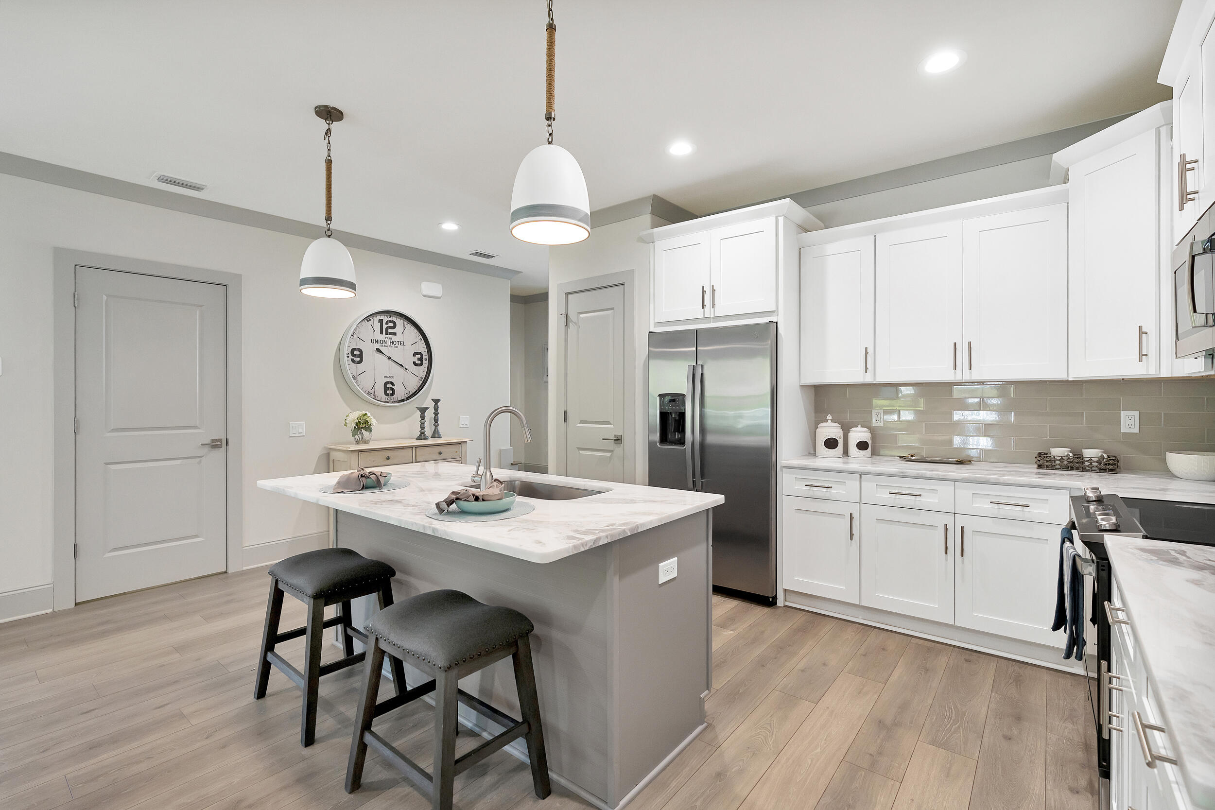 36 Golden Bell Ct Inlet Beach, Unit 36A Inlet Beach, FL 32461 - Photo 8 of 43 a kitchen with stainless steel appliances granite countertop a sink a stove a refrigerator and island with wooden floor