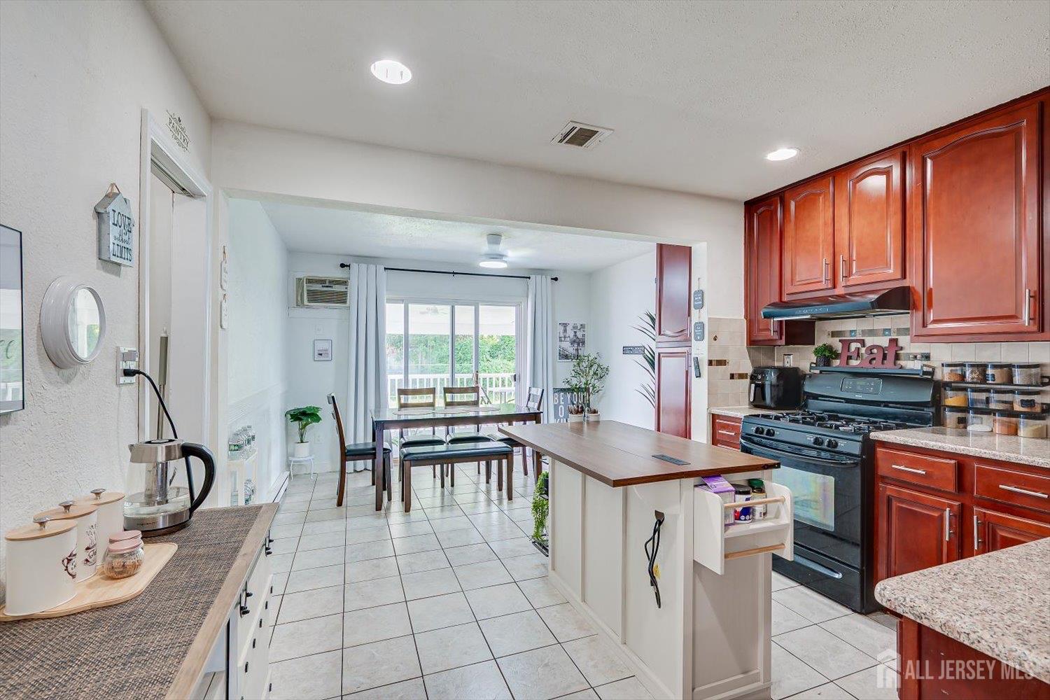 15 Markham Road Edison, NJ 08817 - Photo 2 of 32 a kitchen with stainless steel appliances granite countertop a stove top oven a sink dishwasher and cabinets with wooden floor