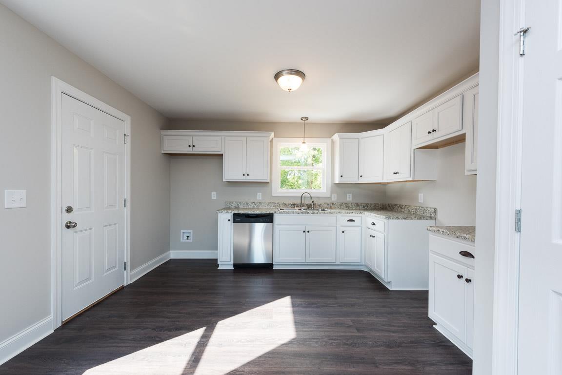 805 East 17th Avenue Springfield, TN 37172 - Photo 11 of 14 Timeless White Cabinetry and Stainless Appliances create a bright Kitchen space!