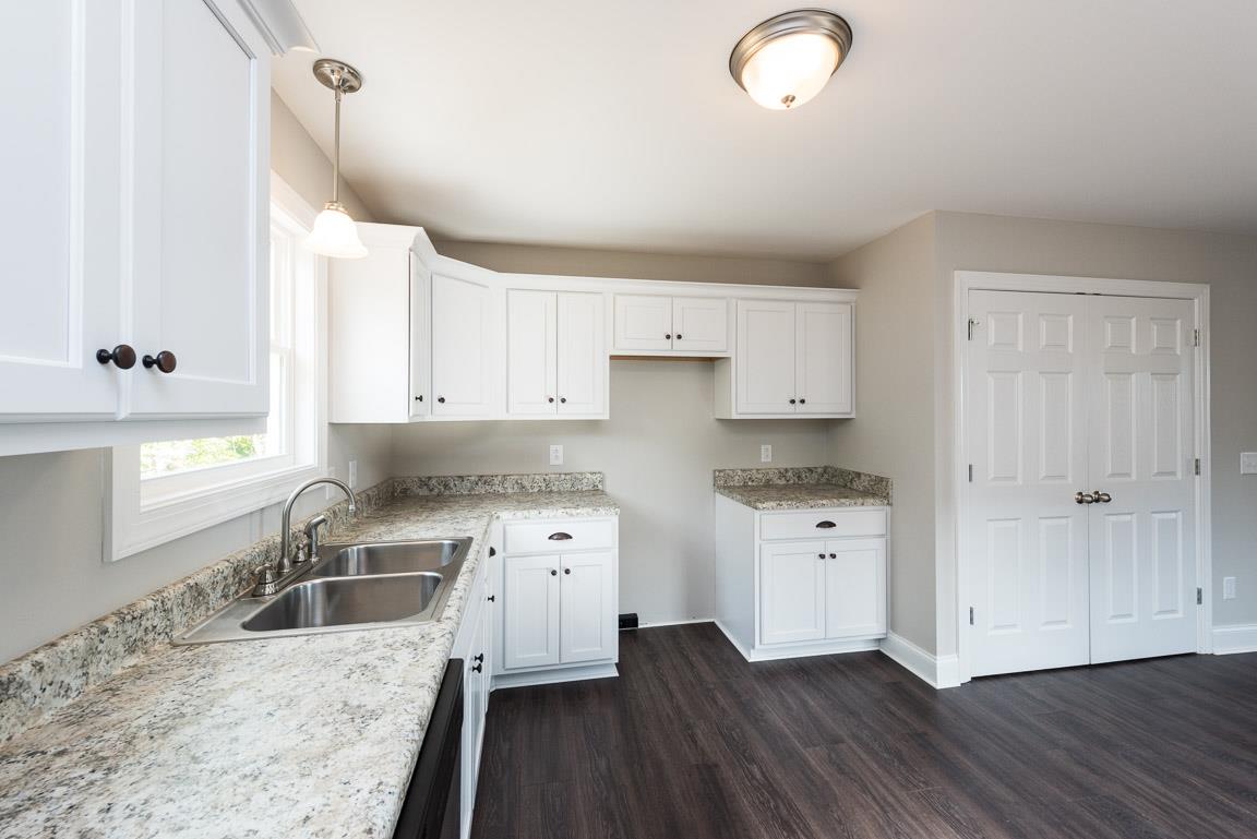 805 East 17th Avenue Springfield, TN 37172 - Photo 12 of 14 Timeless White Cabinetry and Stainless Appliances create a bright Kitchen space!