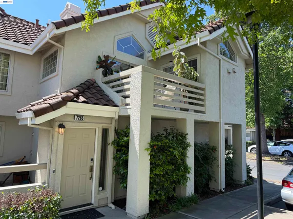 front view of a house with a small yard