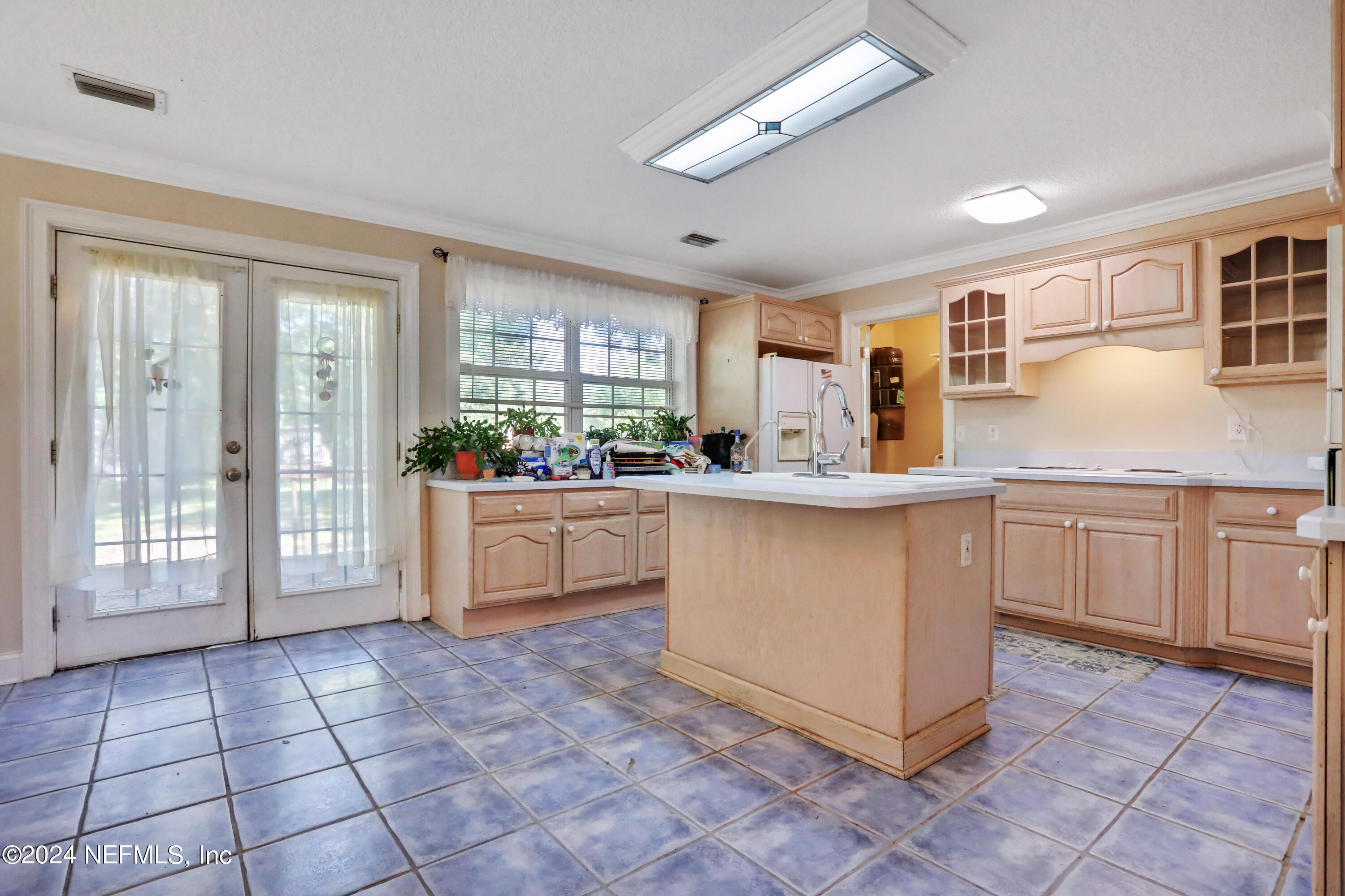 5321 Sweat Road Green Cove Springs, FL 32043 - Photo 12 of 31 a kitchen with stainless steel appliances granite countertop a stove a sink dishwasher and a refrigerator