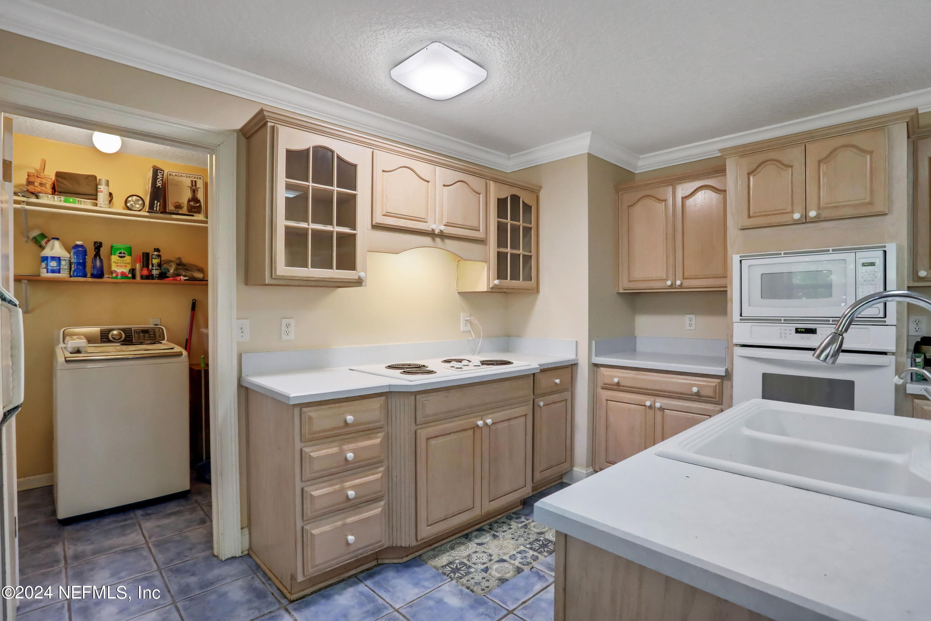 5321 Sweat Road Green Cove Springs, FL 32043 - Photo 14 of 31 a kitchen with a stove a sink and a refrigerator