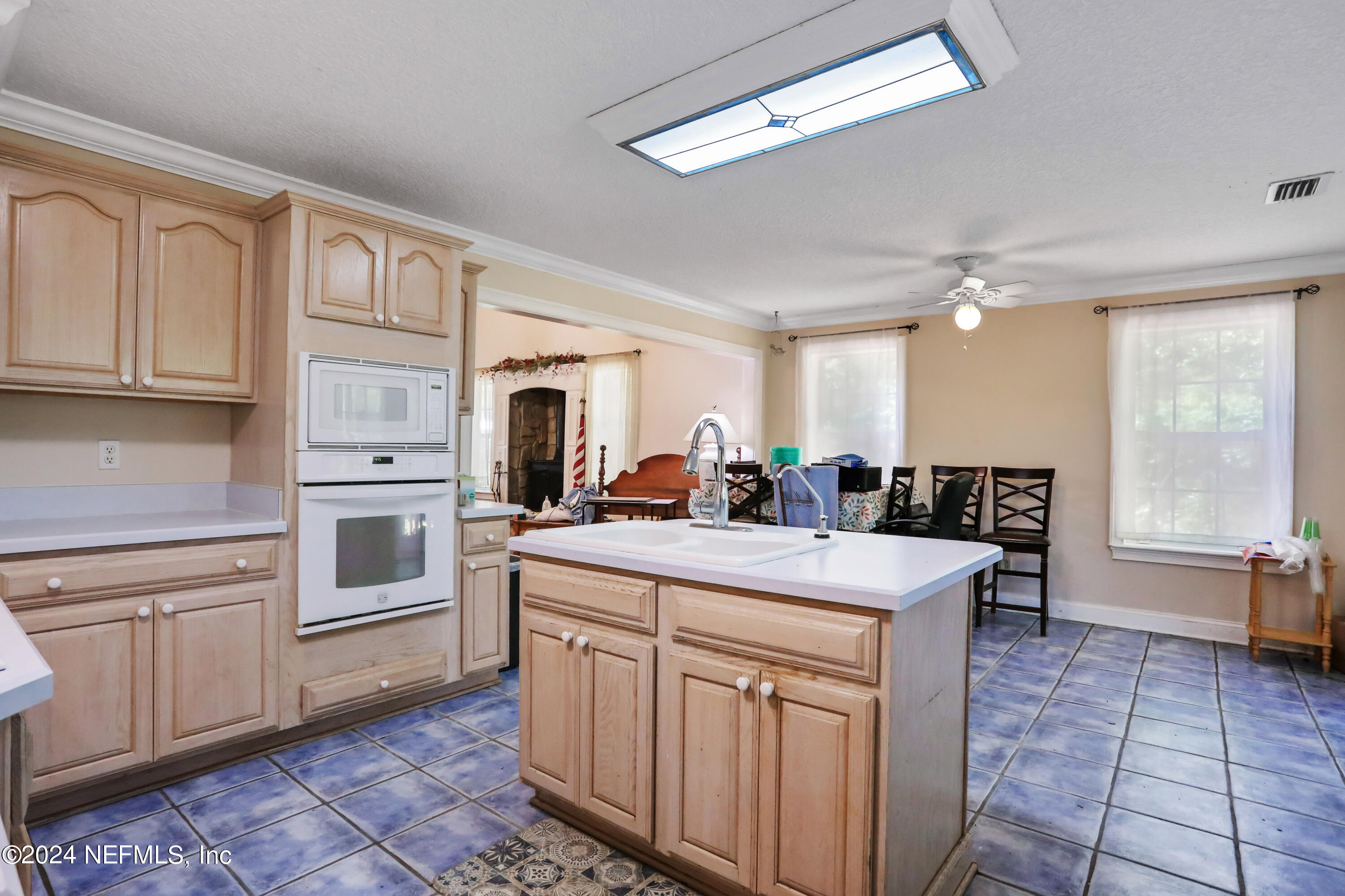 5321 Sweat Road Green Cove Springs, FL 32043 - Photo 15 of 31 a kitchen with a stove a sink and cabinets