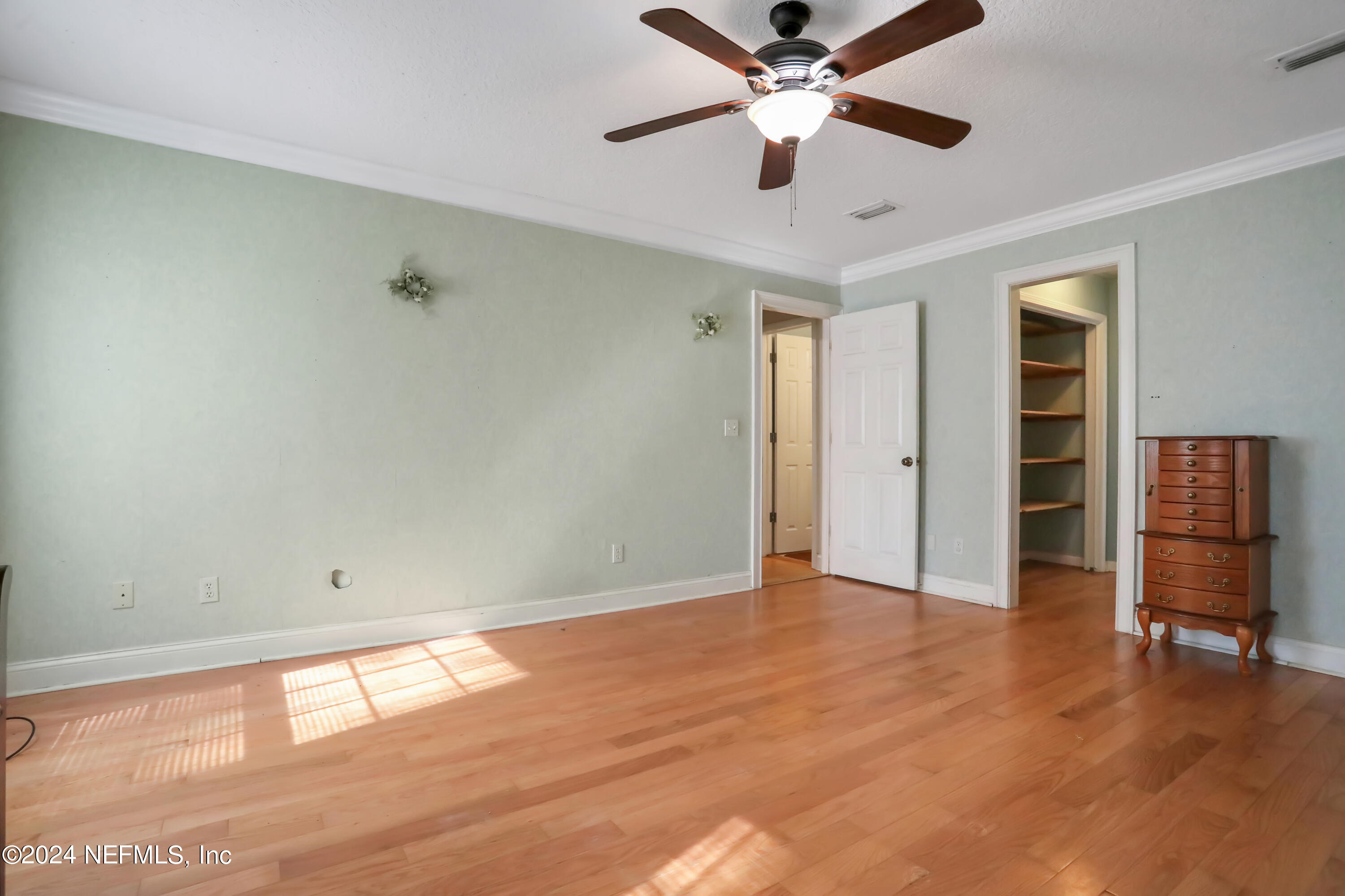 5321 Sweat Road Green Cove Springs, FL 32043 - Photo 18 of 31 wooden floor in an empty room with a window