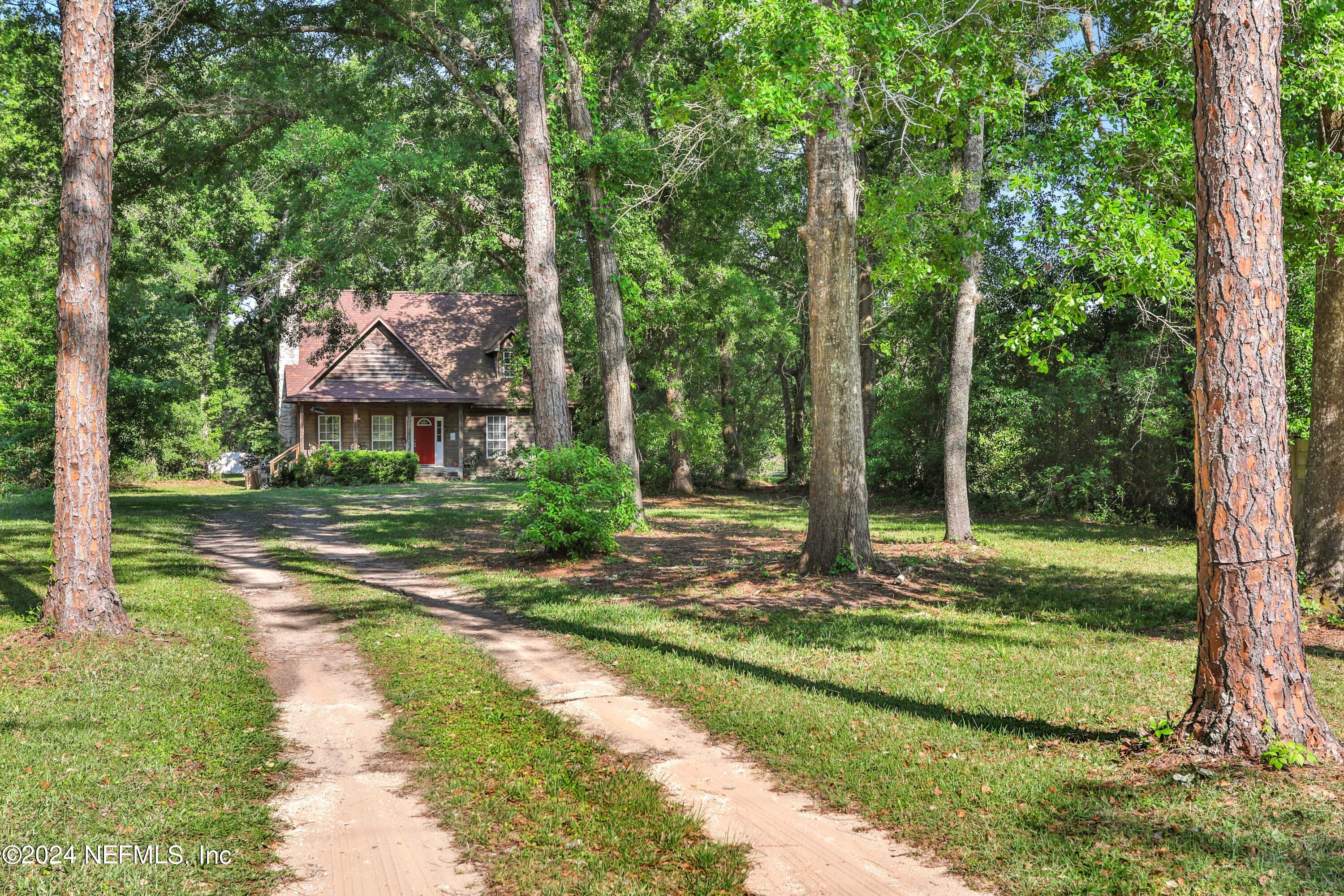 5321 Sweat Road Green Cove Springs, FL 32043 - Photo 2 of 31 a view of a house with backyard and a tree