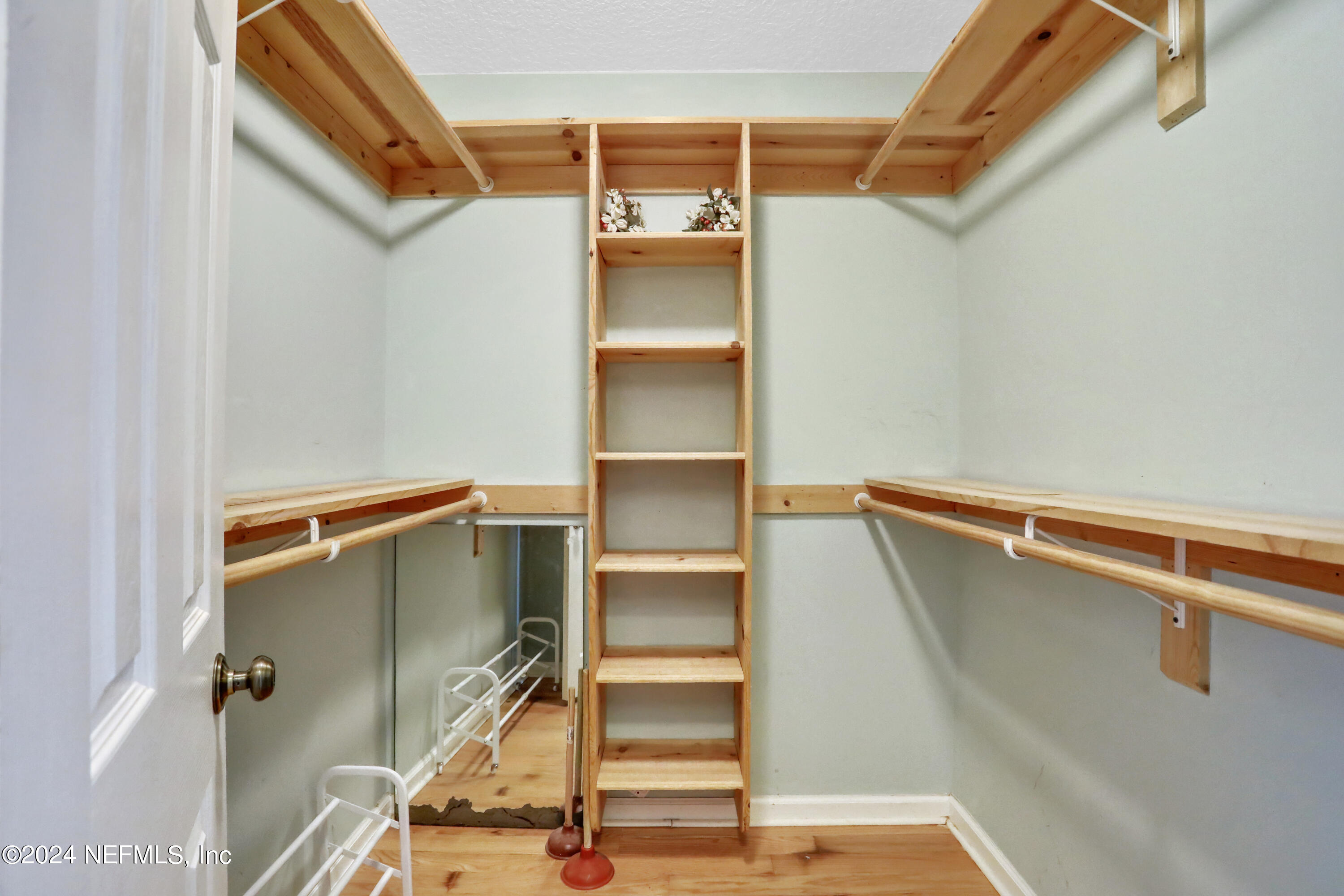 5321 Sweat Road Green Cove Springs, FL 32043 - Photo 22 of 31 a view of walk in closet with empty racks