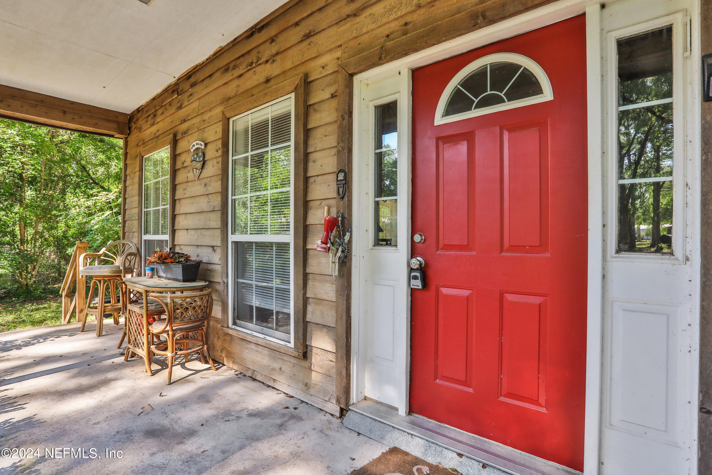 5321 Sweat Road Green Cove Springs, FL 32043 - Photo 9 of 31 a view of front door with outdoor seating
