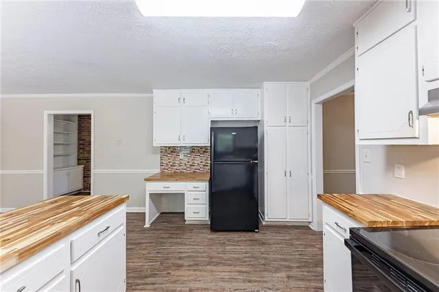a kitchen with a stove and a refrigerator