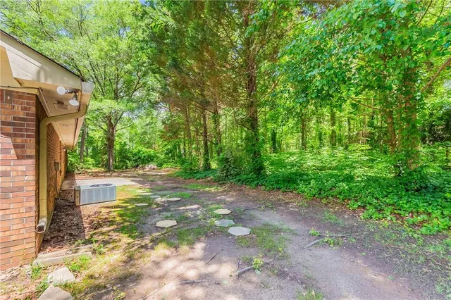 a backyard of a house with lots of green space