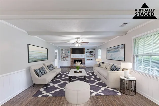 a living room with furniture and a fireplace