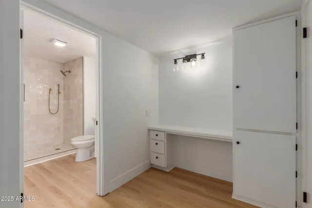 a view of bathroom with a toilet a sink and a shower