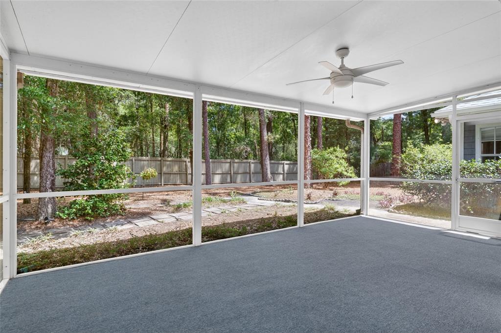 9626 Southwest 53rd Road Gainesville, FL 32608 - Photo 20 of 23 a view of a living room and floor to ceiling window