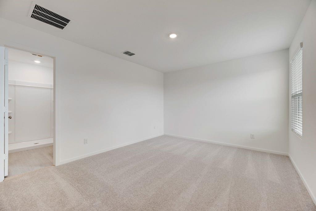 109 Pecan Flts Road Balch Springs, TX 75181 - Photo 6 of 26 an empty room with windows