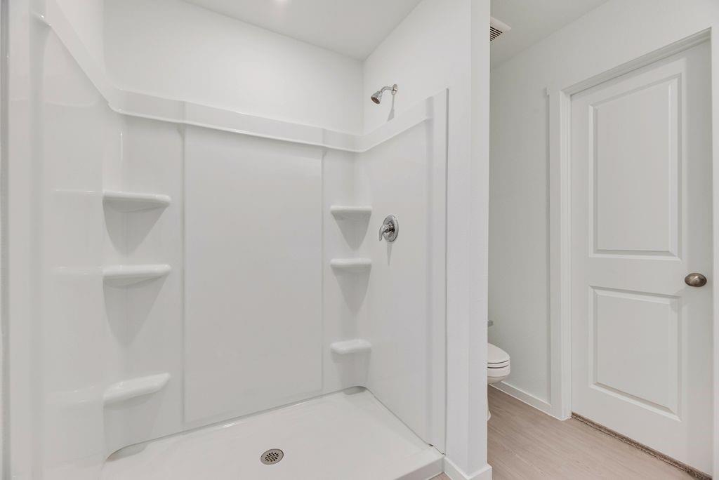 109 Pecan Flts Road Balch Springs, TX 75181 - Photo 8 of 26 a bathroom with a sink a toilet and shower