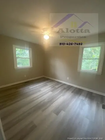 a view of an empty room and window