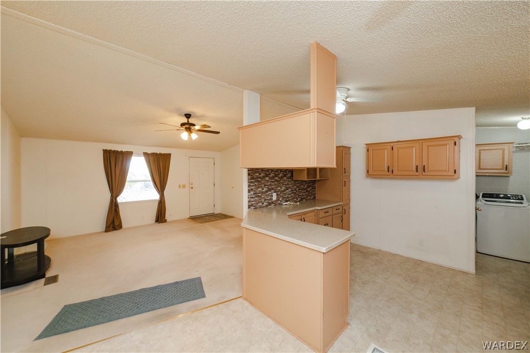 3003 Hualapai Mountain Road Kingman, AZ 86401 - Photo 10 of 49 a kitchen with a stove and a refrigerator