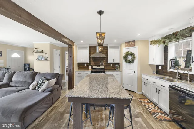 a large kitchen with granite countertop lots of counter top space