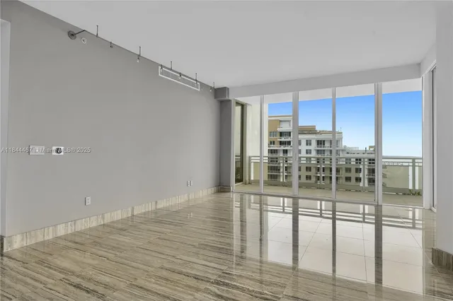 a kitchen with granite countertop a stove and cabinets