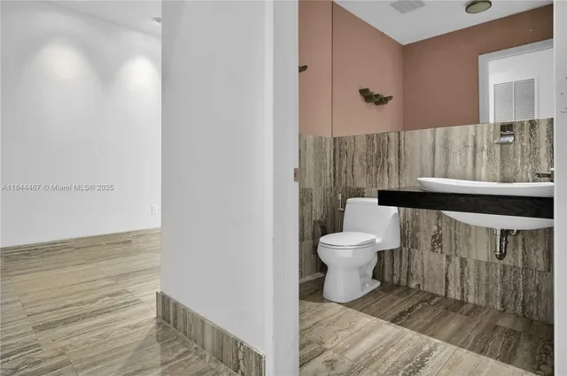 a bathroom with a glass door