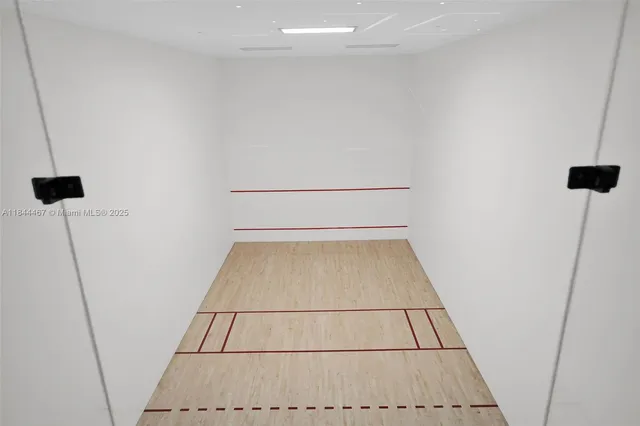 a room with gym equipment and mirrors