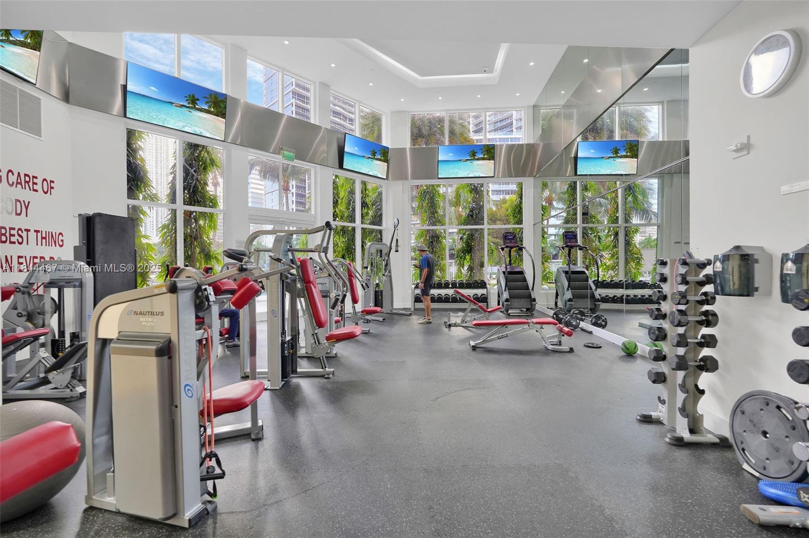 901 Brickell Key Boulevard, Unit 3204 Miami, FL 33131 - Photo 51 of 54 a view of a room with gym equipment
