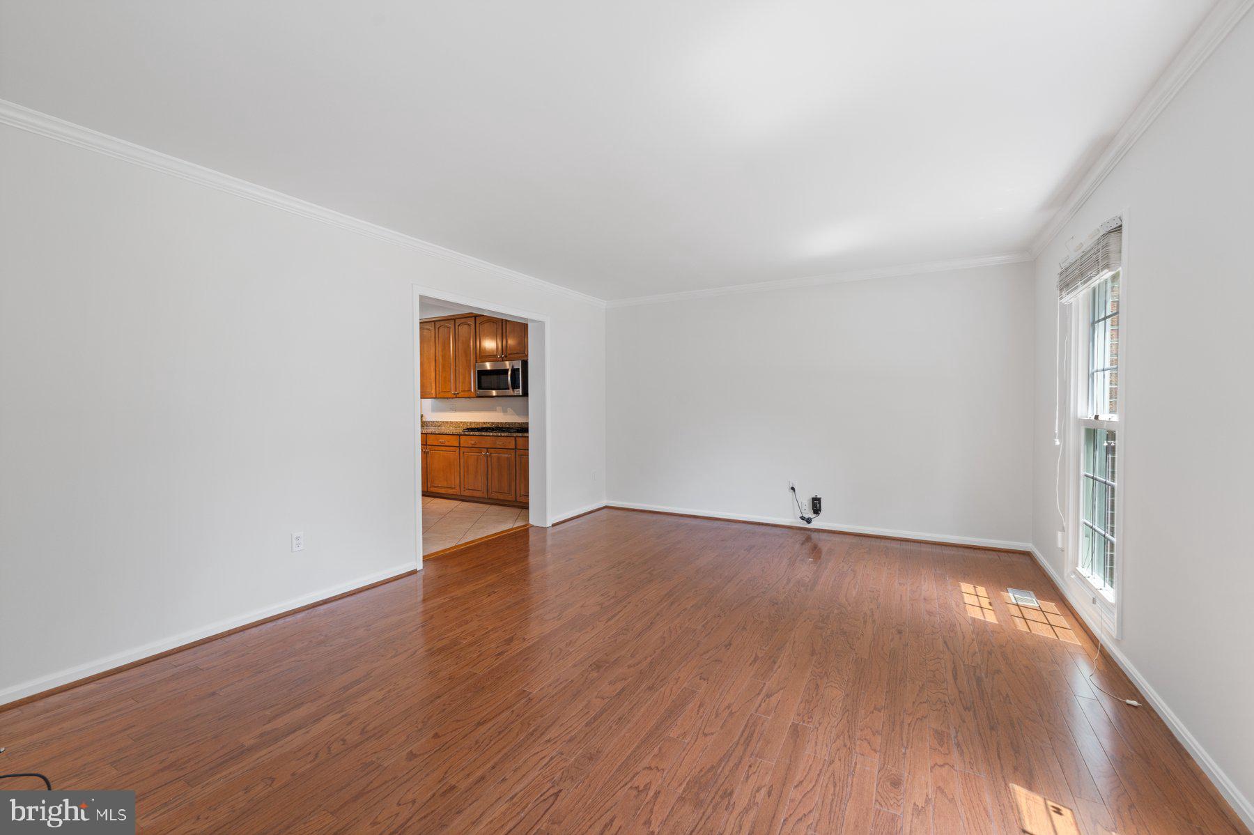 301 Saddle Ridge Road Annapolis, MD 21403 - Photo 10 of 47 Living space with wood floors opens to the kitchen