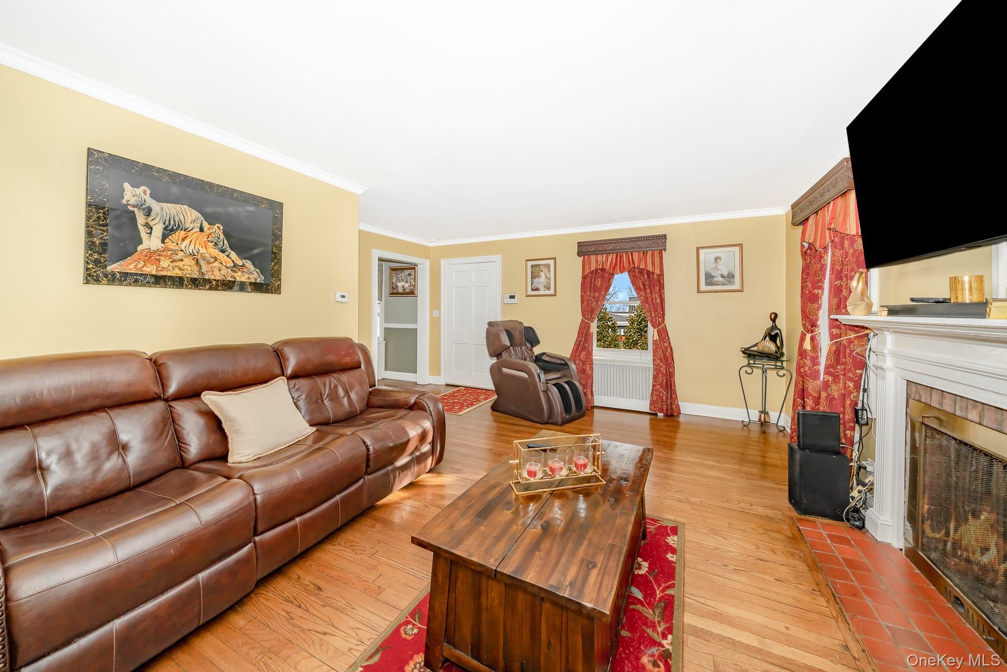 25 Old Mill Road Merrick, NY 11566 - Photo 8 of 19 Living Room w/ Wood Burning Fireplace