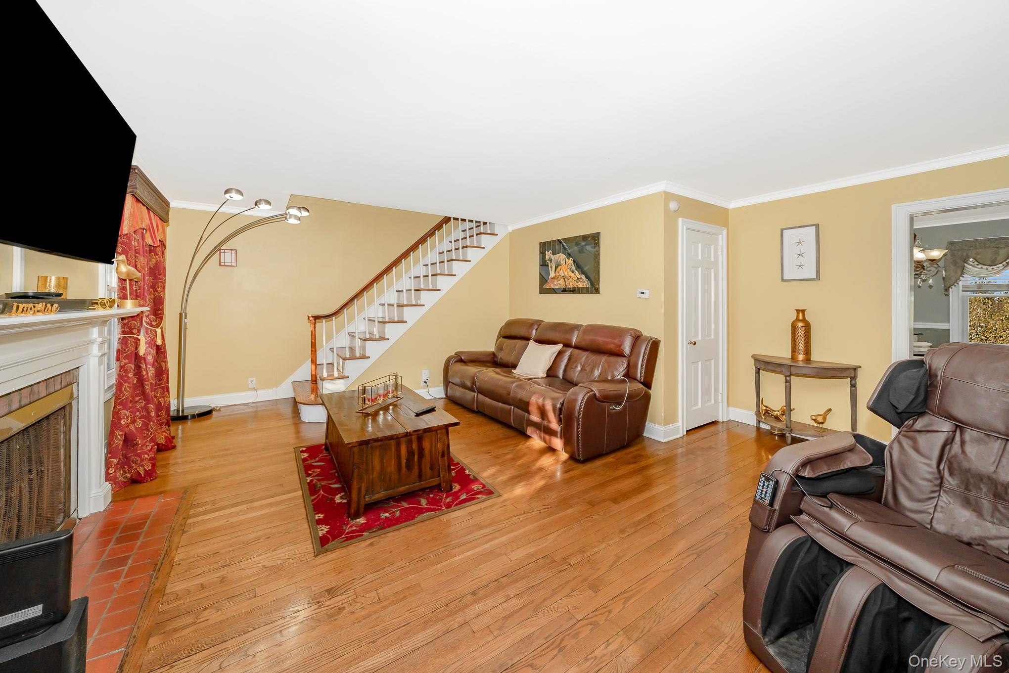25 Old Mill Road Merrick, NY 11566 - Photo 9 of 19 Living Room w/ Rear Staircase