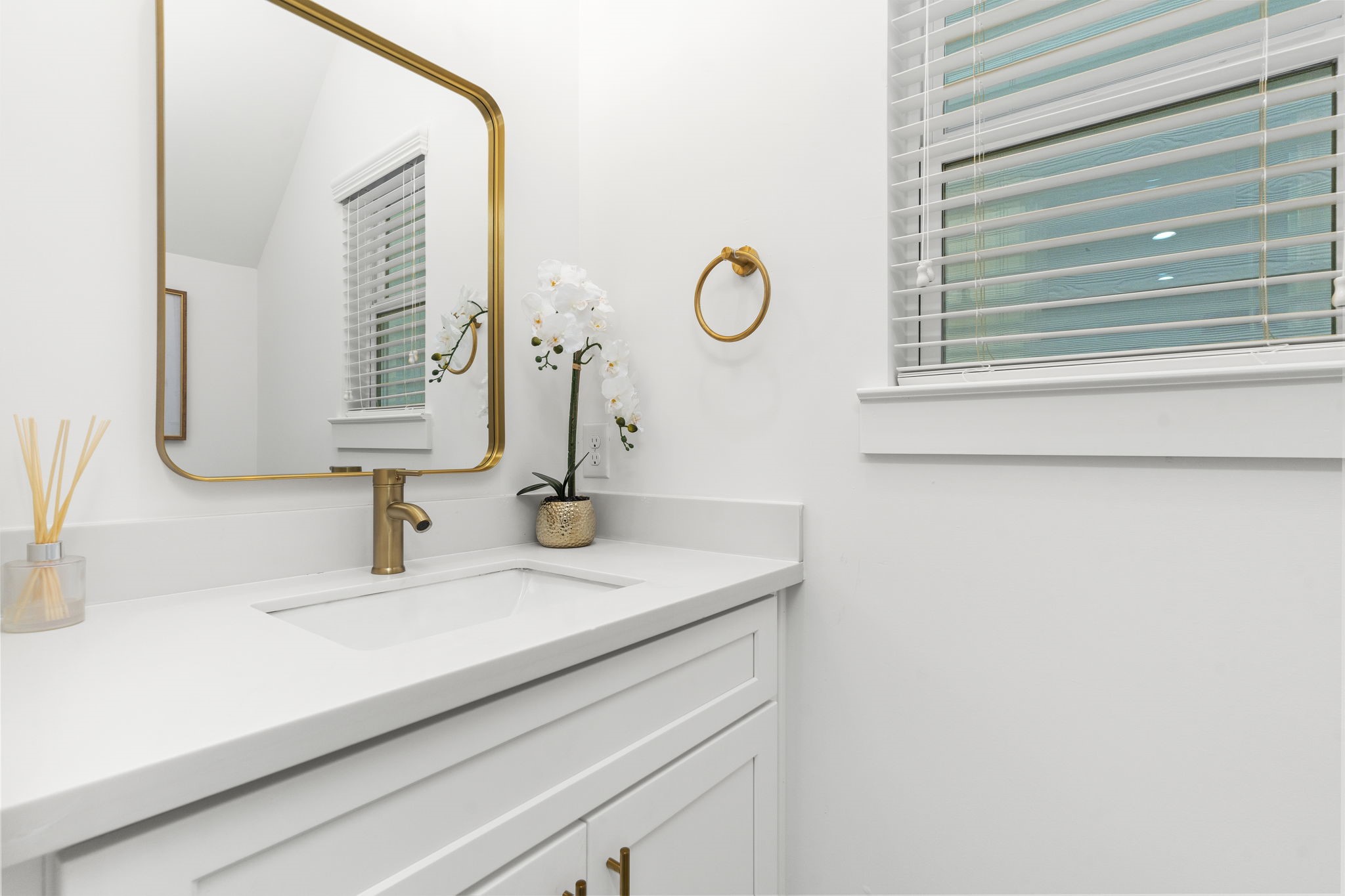 1517 Egypt Street Houston, TX 77009 - Photo 12 of 46 a bathroom with a sink and a mirror