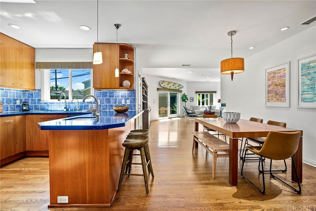 831 Appleby Street Venice, CA 90291 - Photo 4 of 39 a living room with dining table and a wooden floor