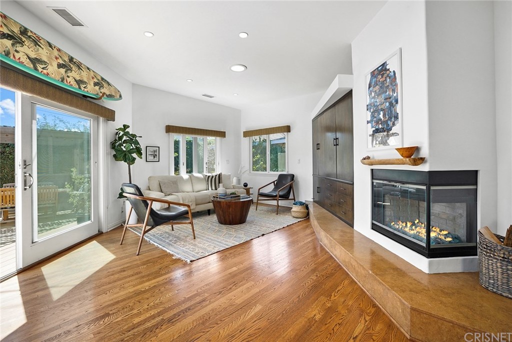 831 Appleby Street Venice, CA 90291 - Photo 5 of 39 a living room with furniture a fireplace and a large window with wooden floor