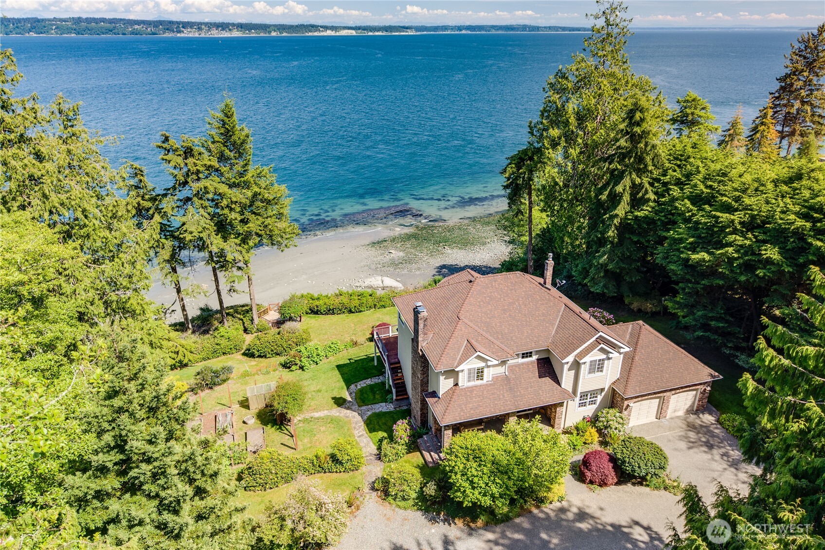 252 Jansen Road Nordland, WA 98358 - Photo 21 of 40 a view of a lake with a building in the background