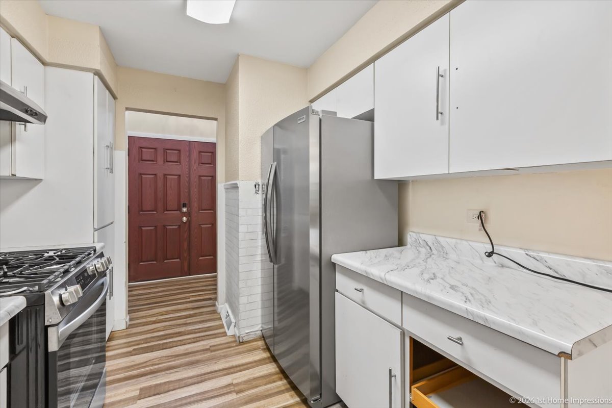 18847 May Avenue Homewood, IL 60430 - Photo 9 of 26 a kitchen with a sink stove and refrigerator