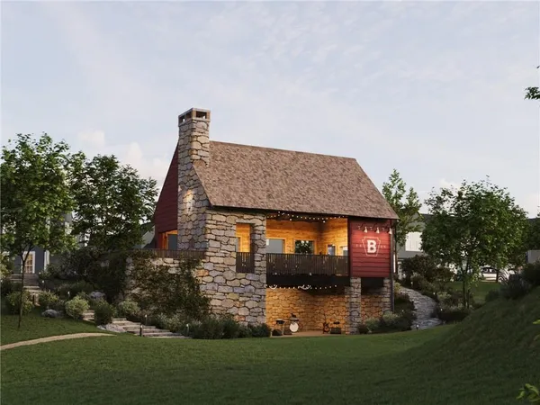 a front view of a house with a garden and yard