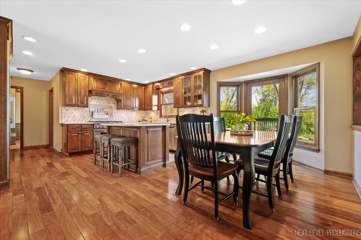 87 Hawkins Circle Wheaton, IL 60189 - Photo 11 of 42 a view of a dining room with furniture window and wooden floor