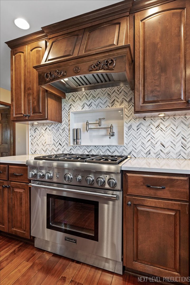 87 Hawkins Circle Wheaton, IL 60189 - Photo 13 of 42 a stove top oven sitting inside of a kitchen