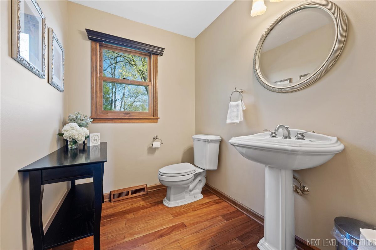 87 Hawkins Circle Wheaton, IL 60189 - Photo 16 of 42 a bathroom with a toilet sink and mirror