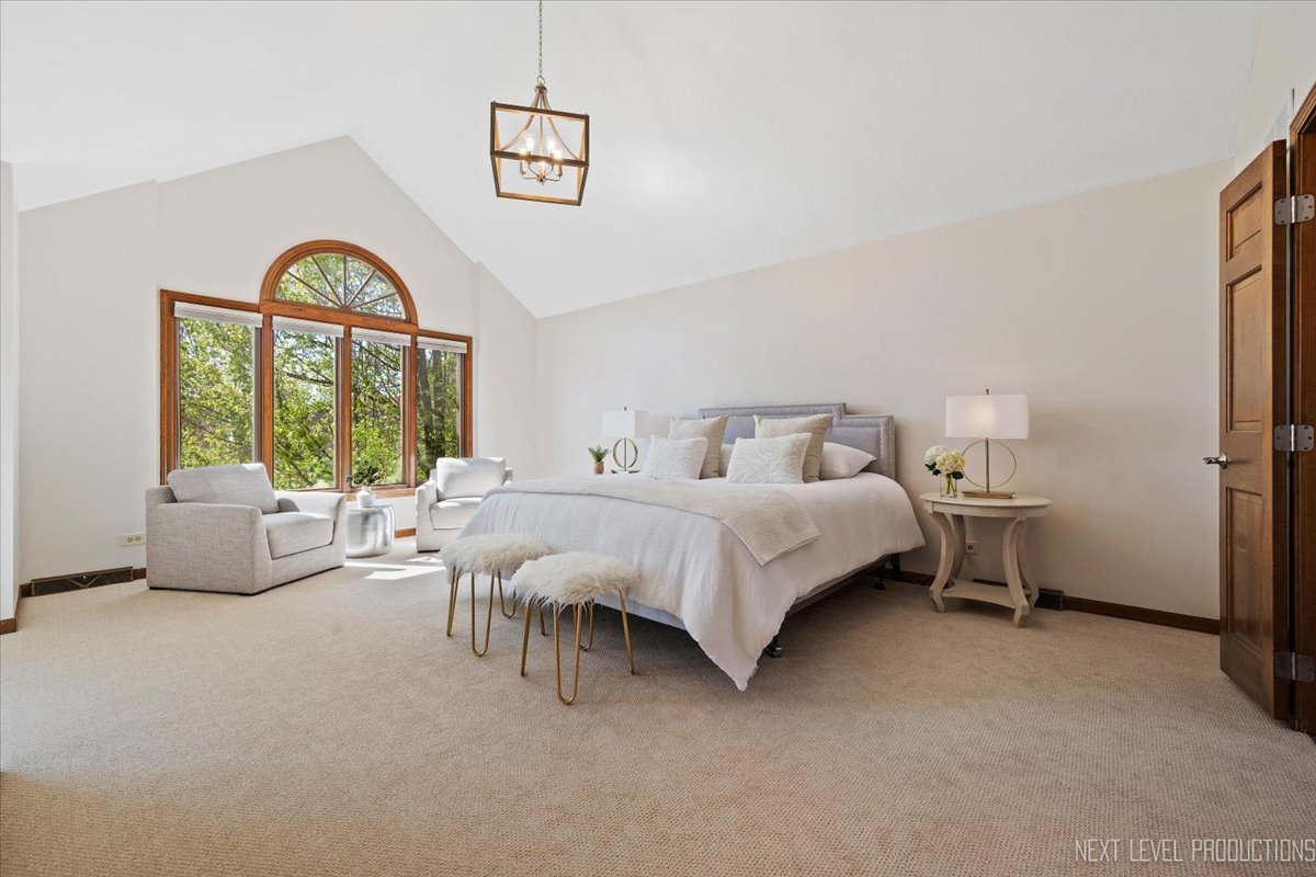 87 Hawkins Circle Wheaton, IL 60189 - Photo 18 of 42 a bedroom with a bed and a large window