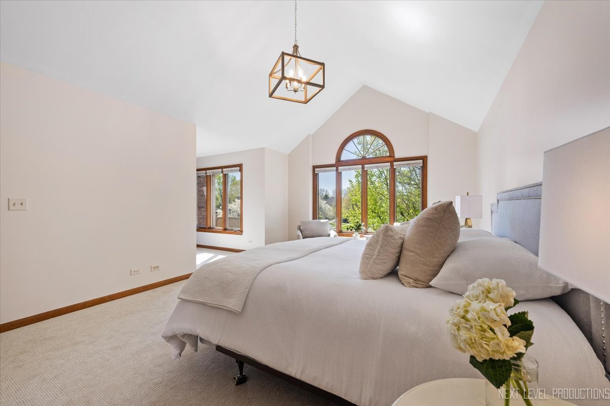 87 Hawkins Circle Wheaton, IL 60189 - Photo 19 of 42 a bedroom with a bed and a window